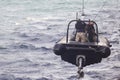 Romanian special forces marines are dropped in a rubber raft